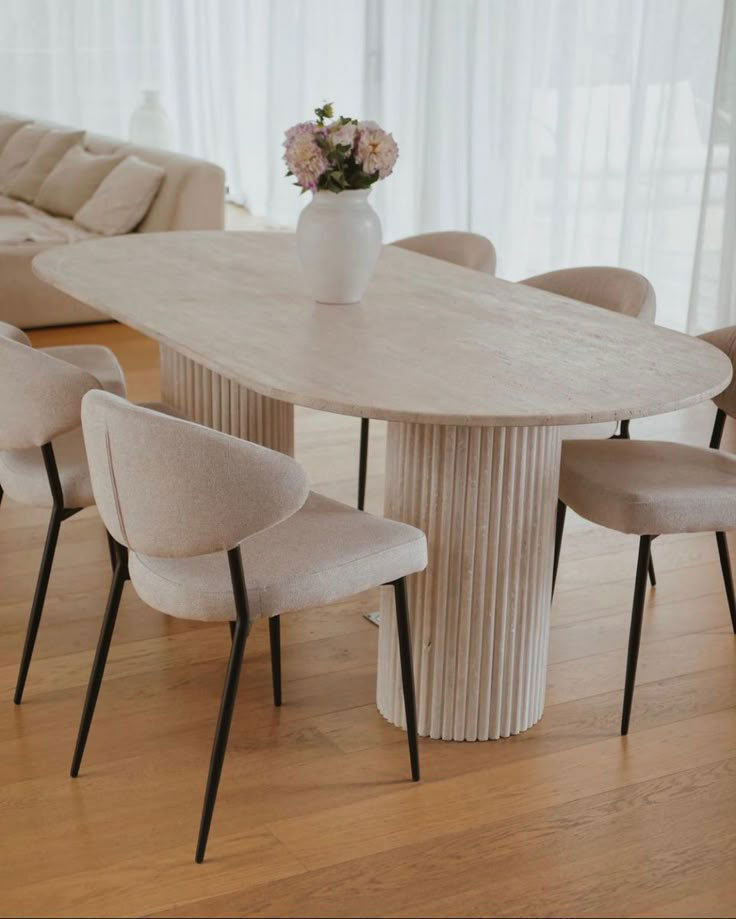 Troia Light Travertine Oval Dining Table with Fluted Round Legs